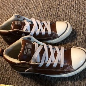 Brown leather converse